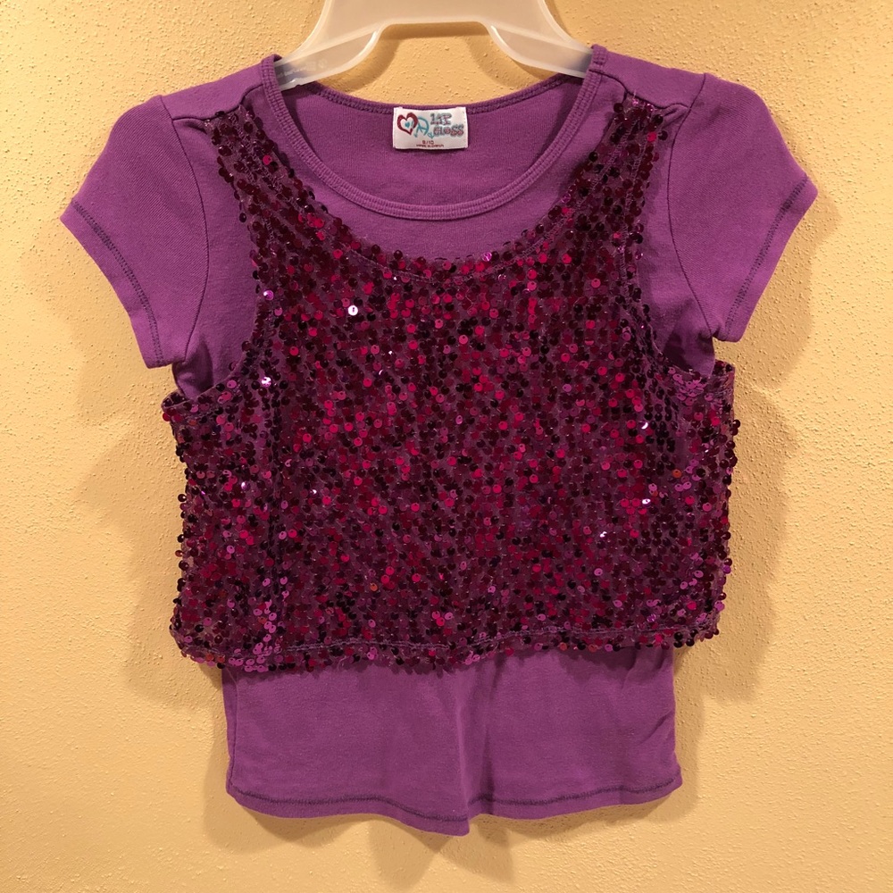 Purple sequined top.
